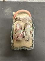 Small doll bed with 2 dolls attached