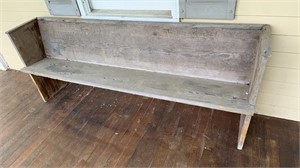Antique 7 foot wood bench on the front porch,