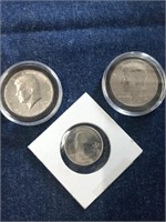 Lot includes two Kennedy half dollars one from