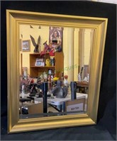 Gold framed beveled glass mirror measures 24x20