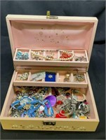 Vintage jewelry box filled with a variety of