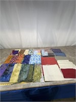 Assortment of Batik fabric, cuts, fabric projects.
