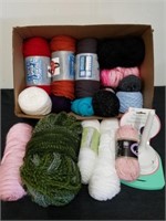 New skeins of yarn and a yarn dispenser
