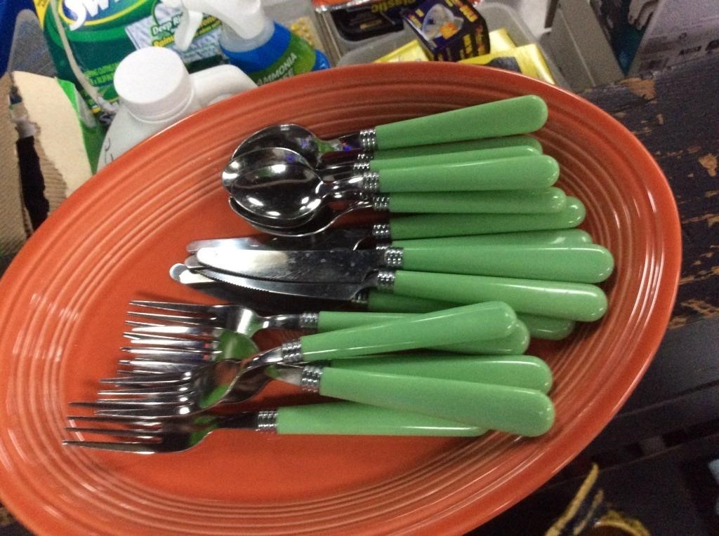 Service for six green handled utensils