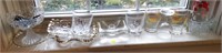 lot of glass ware , candle holders , cups , trays