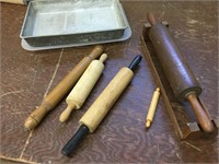 Various rolling pins and metal cake pan with lid