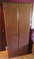 Wood 2-door cabinet. Measures: 72" H x 29" W x