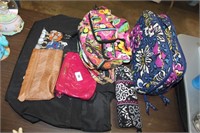 lot of bags. m &m, vera bradly bags, couch