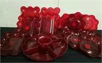 Large group of plastic serving dishes