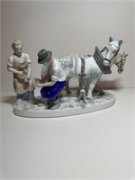 Horses and farrier statue