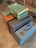 Five pieces of vintage luggage