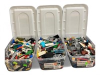 Three small tubs of legos and miscellaneous toys