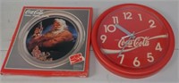 Coca-Cola wall clock and plater.