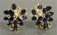 Pair of 14K gold clip earrings set with diamonds &