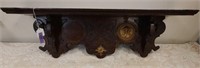 Carved wooden shelf