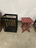 Red Plastic Porch Table and Black Wooden Crate on