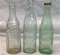 3 vintage soda bottles
