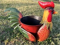 A Quiet Rooster Wing on Spring Metal Planter Pot