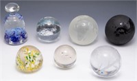 Lot: 7 Assorted Paperweights - Some Branded.