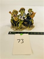 Musical frogs on a log statue