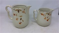 Two Jewel tea pitchers