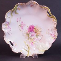 A two-handled 11" porcelain tray with figure