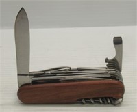 Multi-tool folding knife with wood grain handles.
