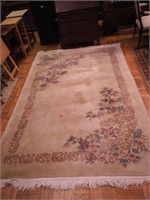 Wool fringed rug, cream ground, floral motif,