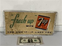 Vintage aluminum 7up advertising sign appears to