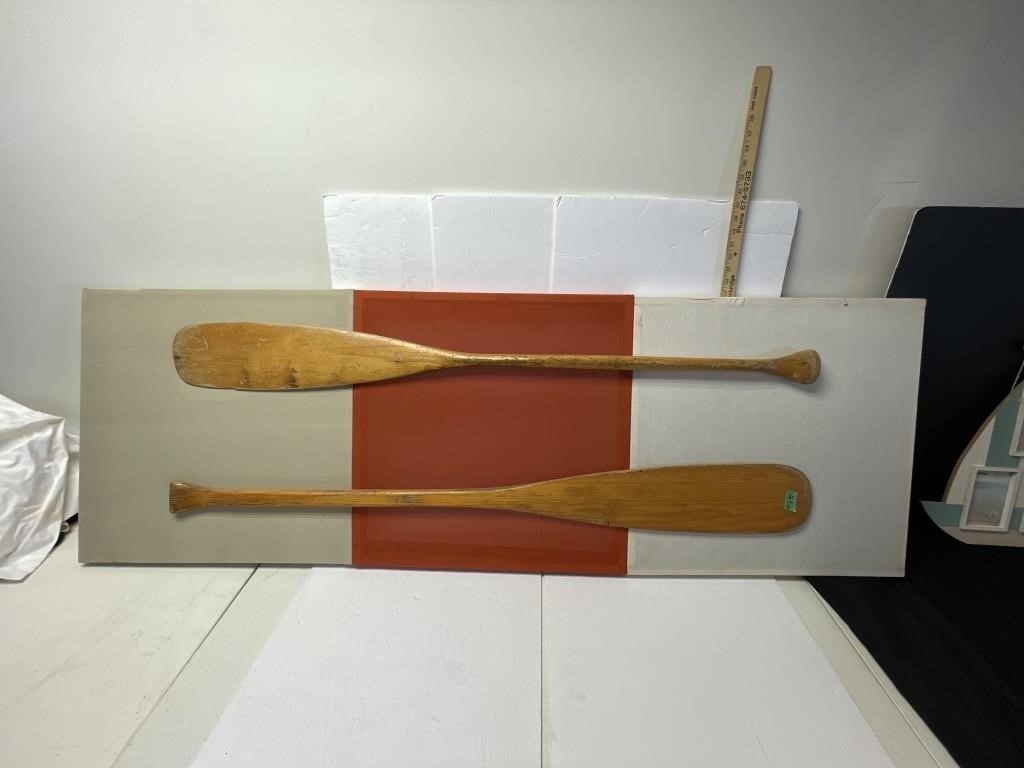 2 Wooden oars on framed backing
