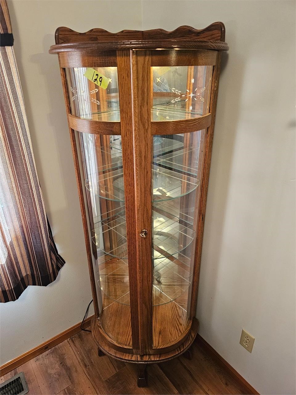 68" Corner curio cabinet with curved glass & light