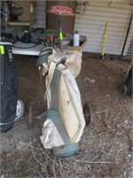 Set of golf clubs and cart