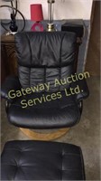 Black leather chair with foot rest