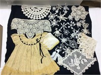 Doilies, crocheted child’s dress, handkerchief