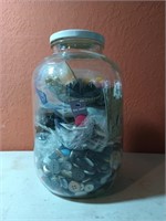 10 inch glass jar full of buttons