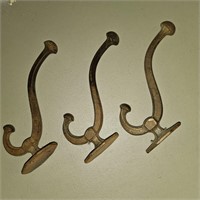 3 ANTIQUE CAST COAT HANGERS