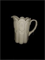 Lovely Off white pottery pitcher approx 9 inches