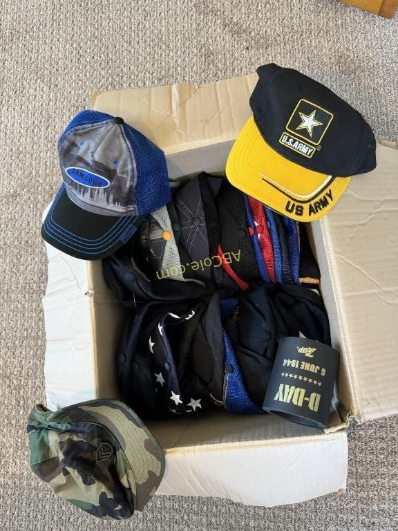 Box filled with over 20 ballcaps and (can) drink