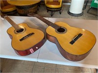 2 wooden guitars