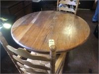 47" Round Oak Table And Two Chairs