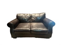 A Brown Leather Loveseat