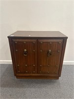 Wooden cabinet with metal studs