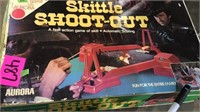 Motorized skittles Shoot out action game