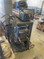 MILLER XMT304 W MILLER WIRE FEED, CART & LEADS