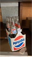 8 pack container of glass pepsi bottles set of 7