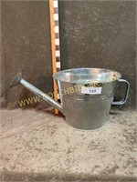 Galvanized water can planter bucket