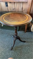 Small round leather top side table, with golden