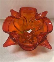Orange art glass bowl, footed with a ruffled