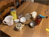 Assorted measuring cups, jars, and containers