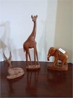 3 woodmen animal figurines. Giraffes ear is